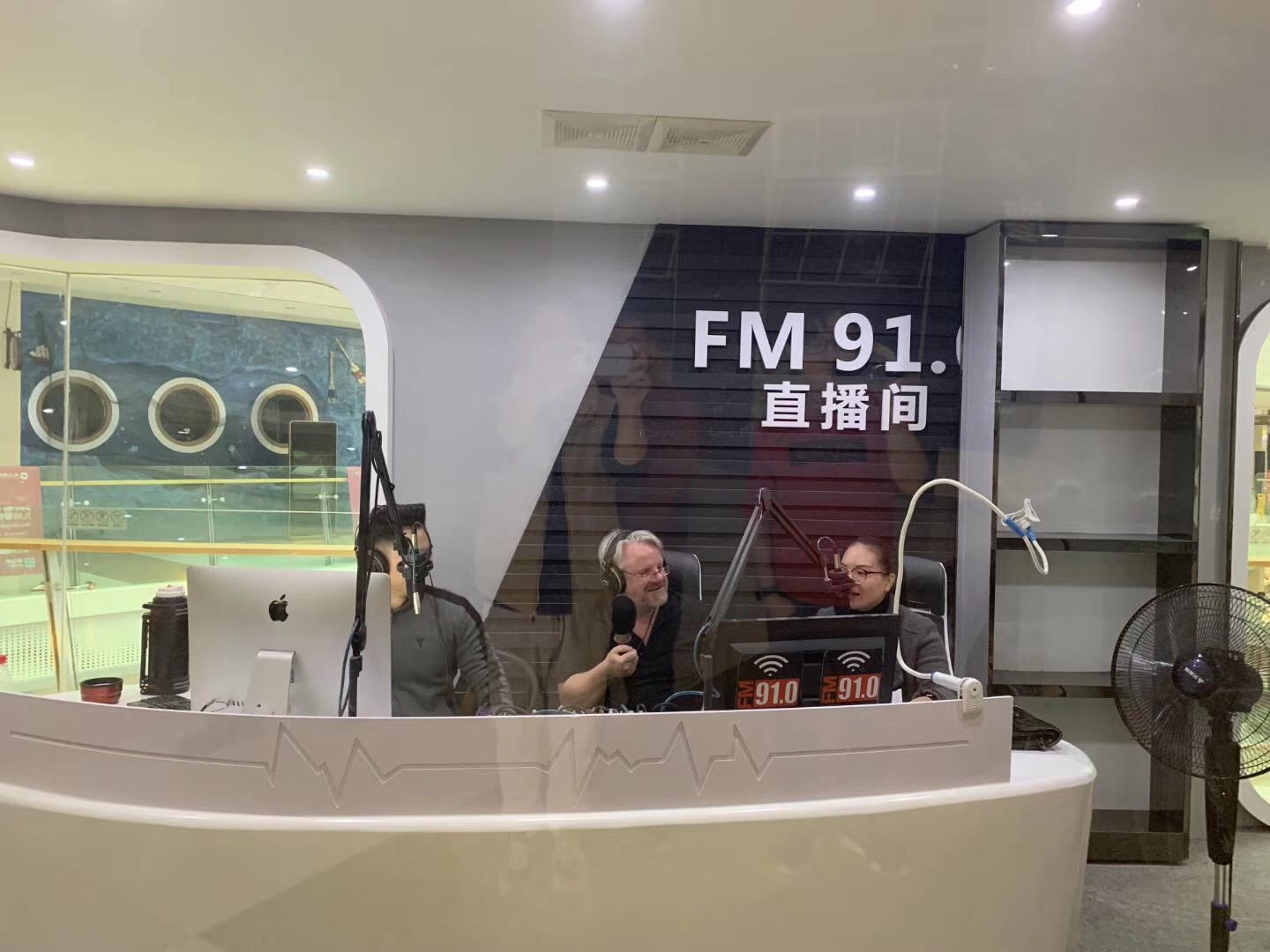 Iain Davie being interviewed in a Chinese radio studio