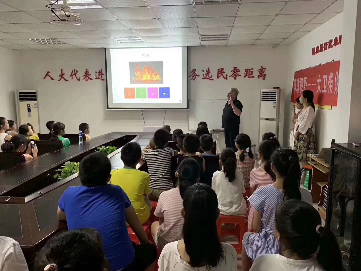 Iain Davie leading a teaching session for children and families in China